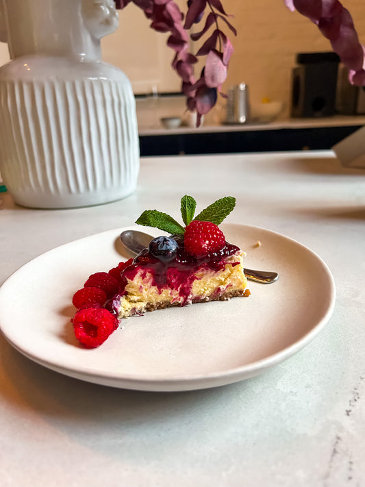 Baked Cheesecake with Homemade Berry Sauce and Fresh Mint