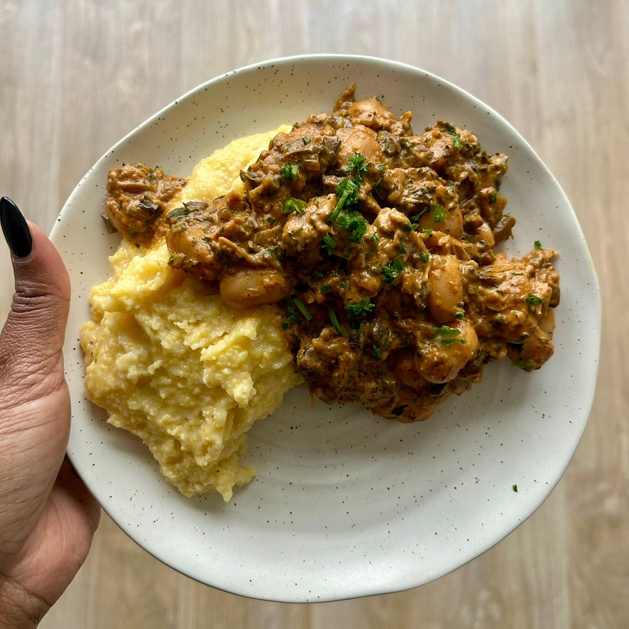 Butter beans simmered in a creamy coconut tamarind sauce with herbs.