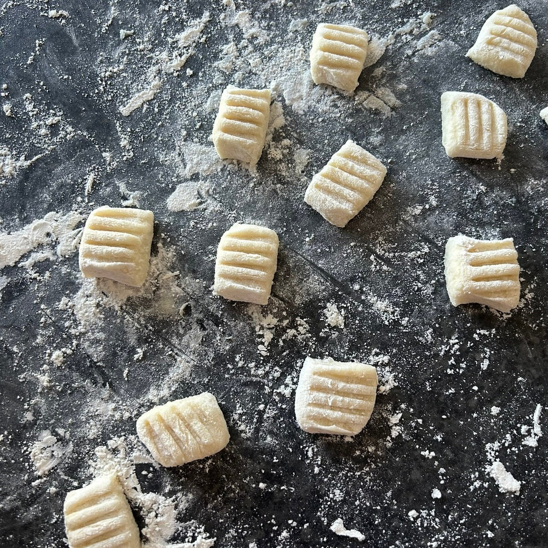 Fresh homemade potato gnocchi shaped into small pillows.