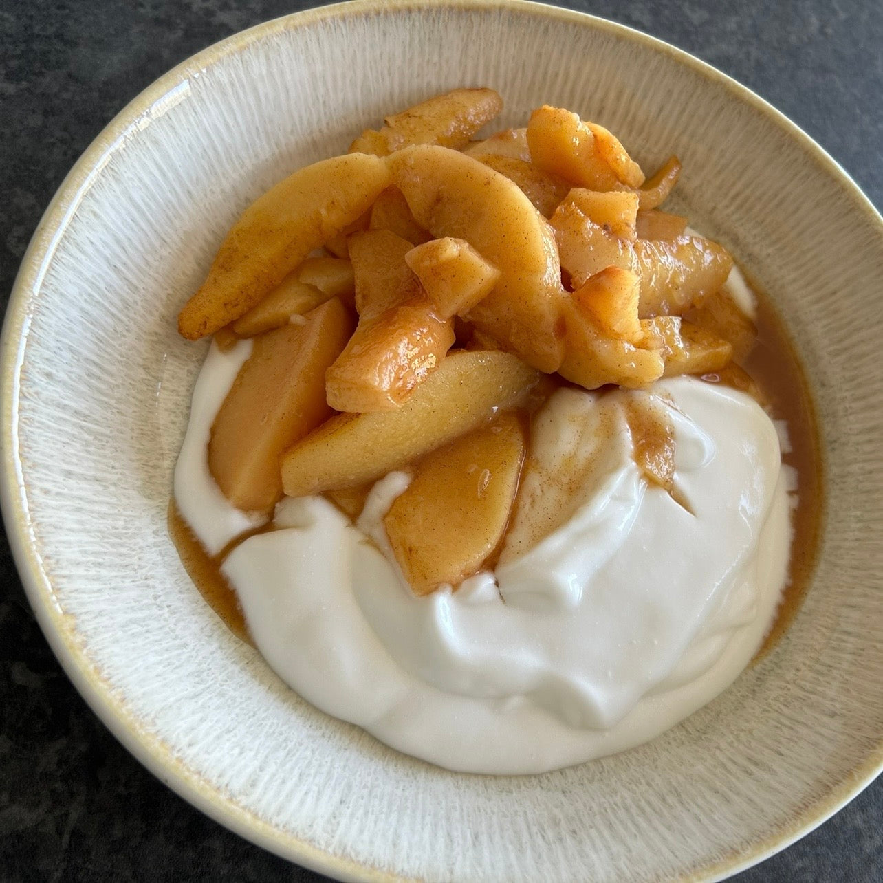 Slow-baked quince wedges with cinnamon and maple syrup.
