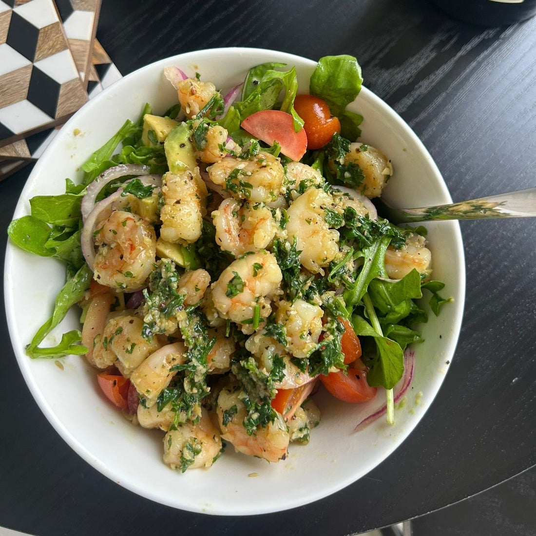 Garlic lemon prawn salad with rocket, cucumber ribbons and cherry tomatoes.